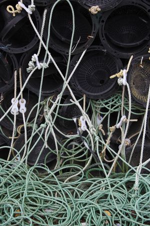 a tangled web of lobster pots and ropesの写真素材