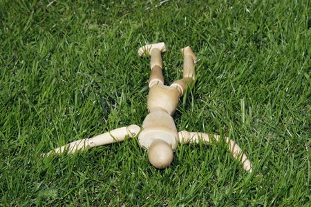 art model man lying in the grassの写真素材