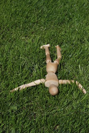 art model man lying in the grassの写真素材