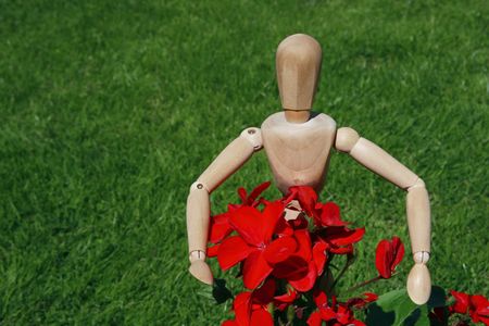 art model man tending to his flowersの写真素材