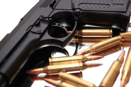 gold ammo and a handgun depicting gun culture