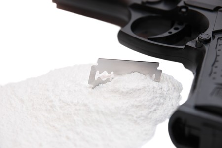 concept of a drug deal or gun hire going down against a white backgroundの写真素材