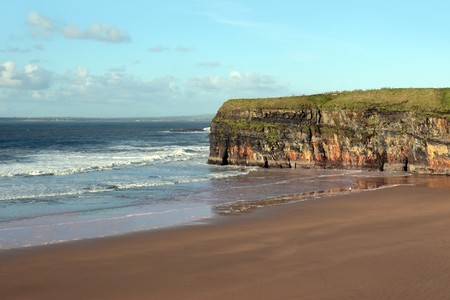 the waves crashing in on ballybunion beach irelandの写真素材