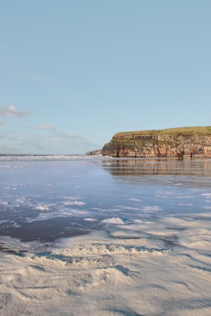 the storm waves crashing in on ballybunion beach irelandの写真素材