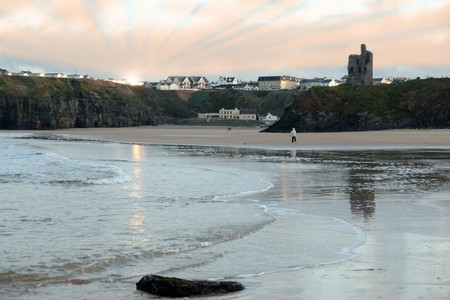ballybunion by the sea with tourists taking a strollの写真素材