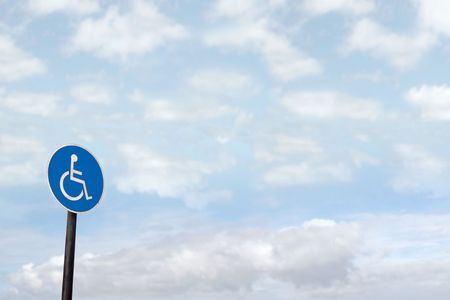 universal wheel chair sign with clouds in the background

の写真素材