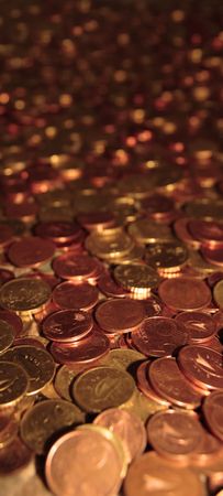 lots of loose change in euro cents and other coins