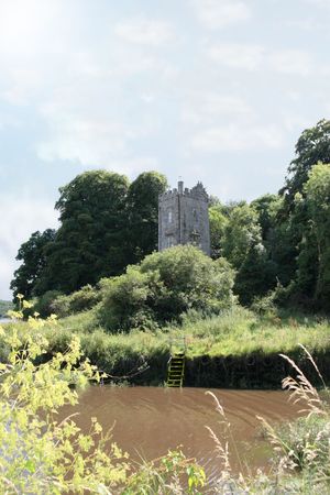 a castle tower in knockanore county waterford in the south of ireland in summer on the blackwater river edgeの写真素材