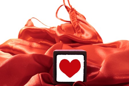 love heart on block on a silk nightie against white backgroundの写真素材