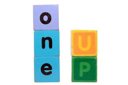 toy letters that spell step up against a white background の写真素材
