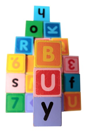 toy letters that spell buy against a white background  の写真素材