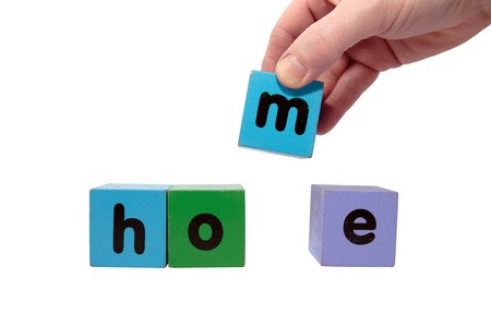 toy letters that spell home against a white background  の写真素材