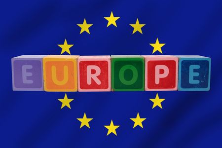 toy letters that spell europe against a flag backgroundの写真素材