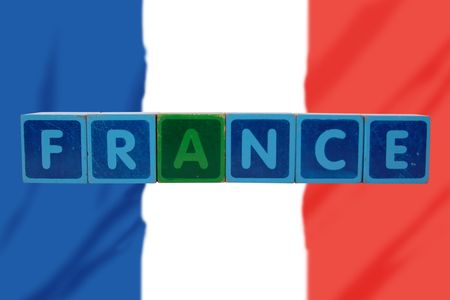 toy letters that spell france against a flag backgroundの写真素材