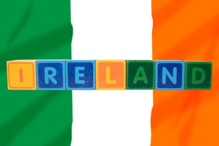 toy letters that spell ireland against a flag background の写真素材
