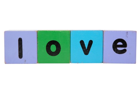 toy letters that spell love against a white background の写真素材
