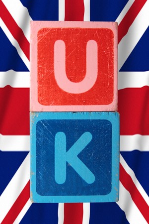 toy letters that spell uk against a flag background の写真素材