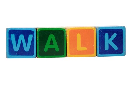 toy letters that spell walk against a white background の写真素材