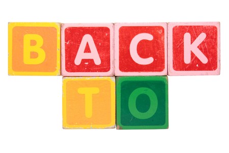 toy letters that spell back to against a white background の写真素材