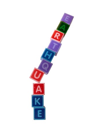 toy letters that spell earthquake against a white background with clipping pathの写真素材