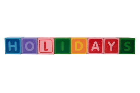 toy letters that spell holidays against a white backgroundの写真素材