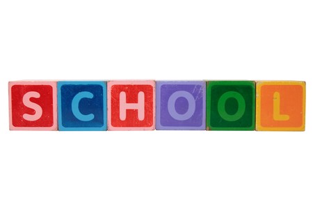 toy letters that spell school against a white backgroundの写真素材