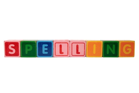 toy letters that spell spelling against a white backgroundの写真素材