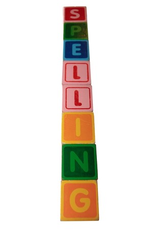 toy letters that spell spelling against a white backgroundの写真素材