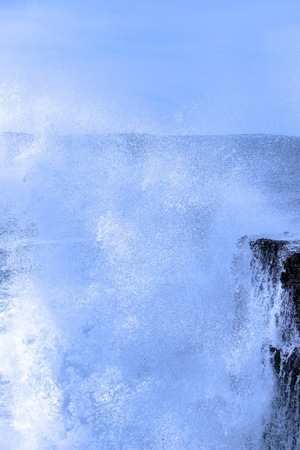 cliffs and coastline of the burren in county clare ireland with giant waves crashing on the rocksの写真素材