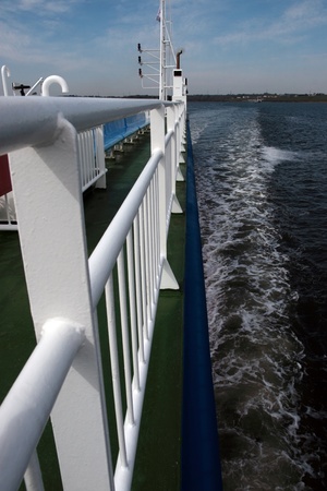 view looking over the rail of a cruising ferry ship の写真素材