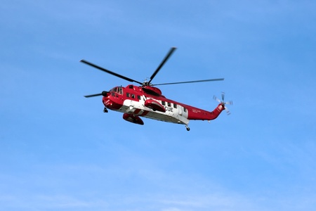 a sea rescue helicopter searching for person  in ballybunion county kerry irelandの写真素材