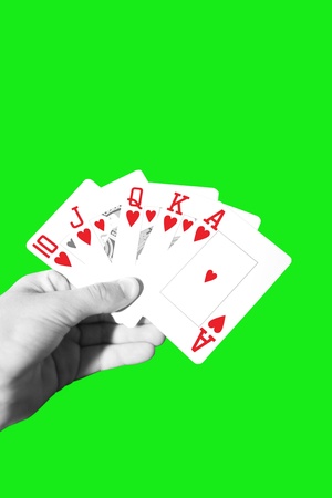 a hand with a royal flush of hearts with clipping pathの写真素材
