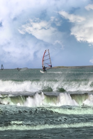 surfers windsurfing in the maharees in county kerry ireland during a storm の写真素材