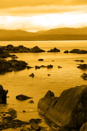 scenic view in kerry ireland of lone yacht sailing inの写真素材