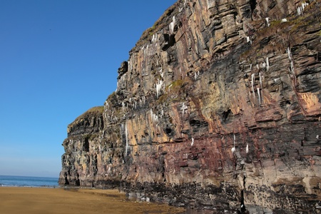icicles on a cliff face on ballybunion beach in ireland on a winters morningの写真素材