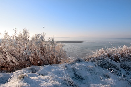 a seasonal snow covered view of atlantic ocean and ballybunion beach on a frosty snow covered winters dayの写真素材