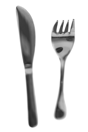 fork and knife isolated against a white background の写真素材
