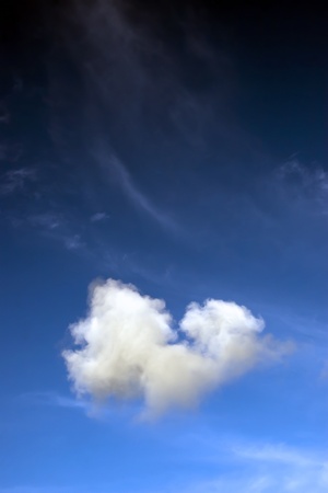 a natural heart shaped cloud in a beautiful blue sky with room for copy space