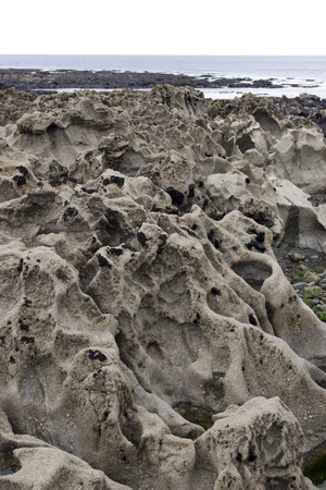 many rock formations on the beach in ballybunion county kerry irelandの写真素材