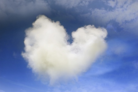 a natural heart shaped cloud in a beautiful blue skyの写真素材
