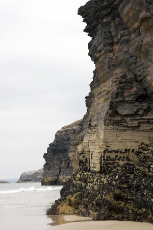 ancient cliffs on the coastal beach in ballybunion county kerry irelandの写真素材