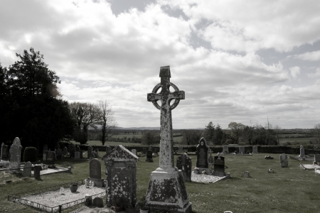 old ancient Celtic graveyard with marked gravestones and flowers in Irelandの写真素材