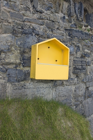 empty life buoy box on the seaside wallの写真素材