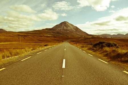 road to the Errigal mountains in county Donegal Ireland on a bright cloudy dayの写真素材