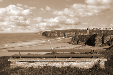 bench on a cliff edge  with views of Ballybunion beach cliffs and castleの写真素材