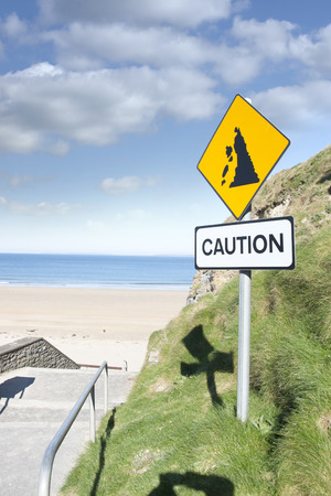 caution loose rocks or landslide sign in Ballybunion beach county Kerry Irelands wild atlantic wayの写真素材