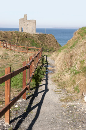 a beautiful fenced path to Ballybunion beach and castleの写真素材