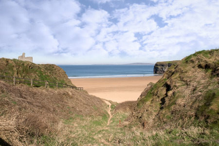 a beautiful fenced path to Ballybunion beach and castleの写真素材