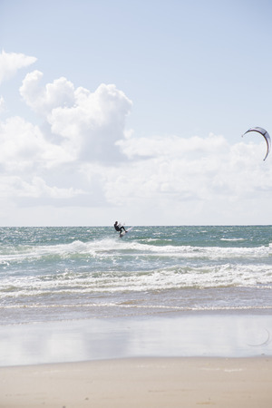 kite surfer on beautiful waves at beach in ballybunion county kerry ireland on the wild atlantic wayの写真素材