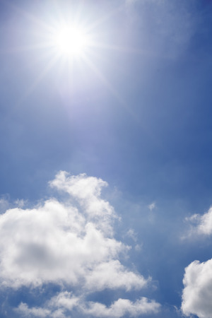 beautiful sunshine over white fluffy clouds in the irsh skyの写真素材